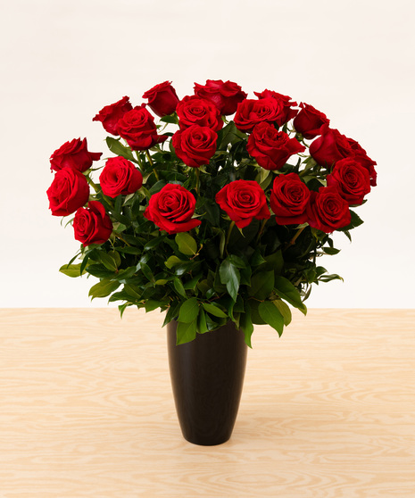 Red Roses in Black Glass Vase